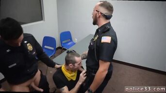 Two cops made the gay make them a blowjob at the police station