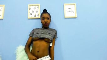 African girl squeezes breast milk from her nipples
