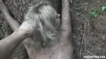 Horror xxx: Maniac with chainsaw fucks bound captives in forest