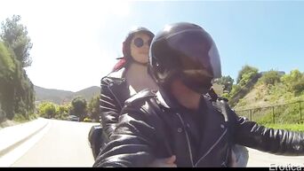 Girl passionately fucks near a motorcycle