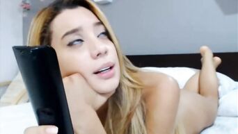British blonde masturbates and experiences orgasm before webcam
