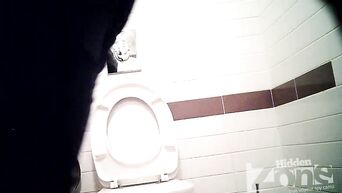 Businesswoman shows shaved pussy, unaware of spy camera in toilet