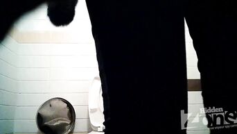 Shows shaved vagina in front of spycam in public toilet