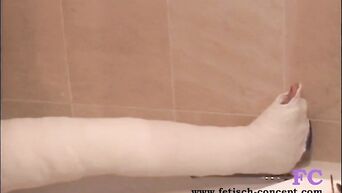 German woman with gypsum on leg masturbates in bathroom
